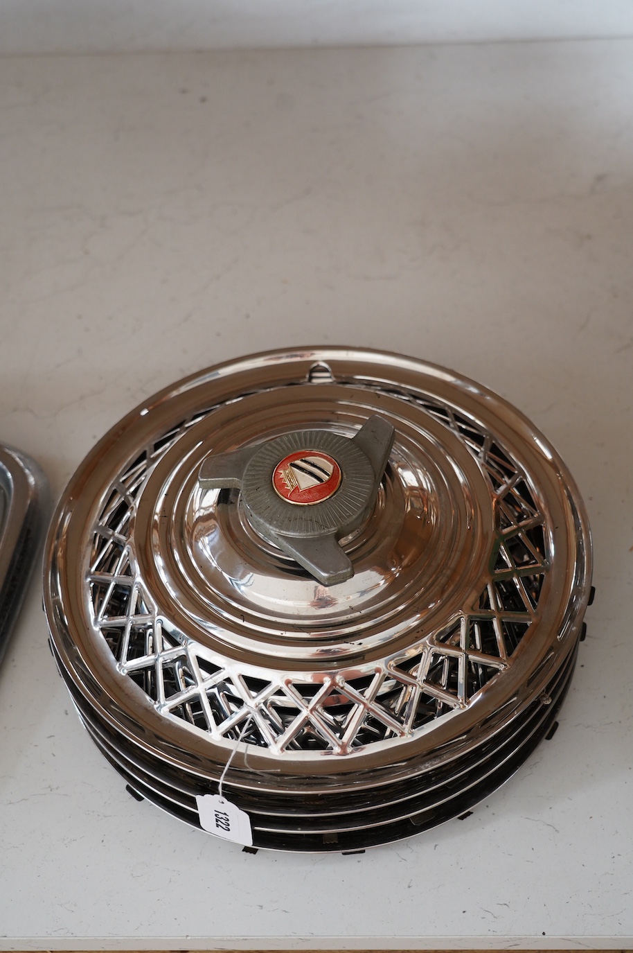 A set of four 1960s US chrome plated automobile hub caps, 38cm diameter. Condition - fair to good